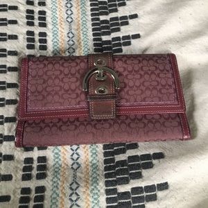 Purple Coach wallet with C print