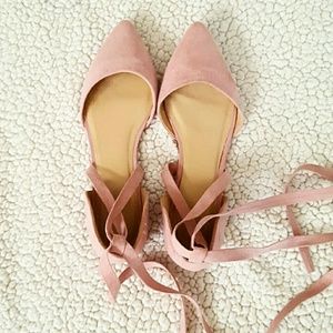Rose pink pointed leather strappy sandals.