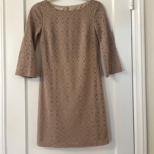 Blush colored eyelet overlay long-sleeve dress.