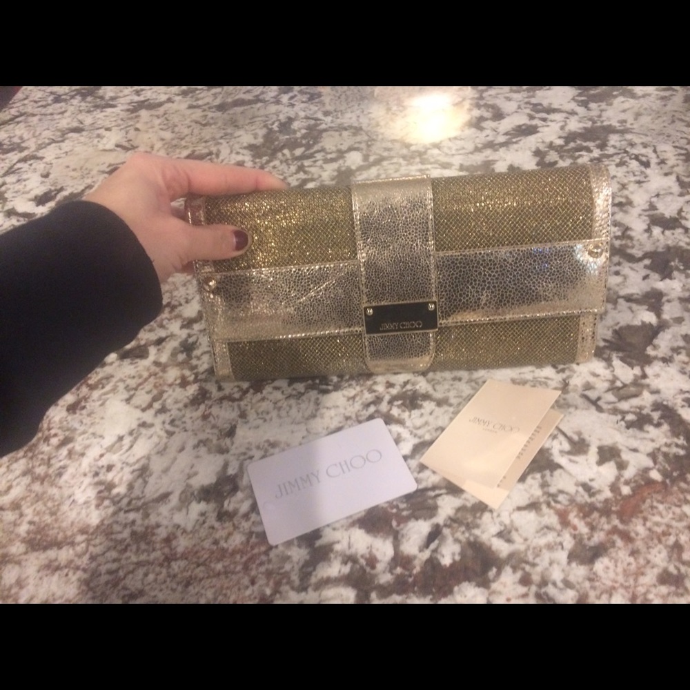 Jimmy Choo gold wallet or evening clutch