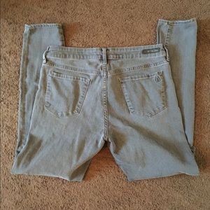 Grey ripped kneed skinny jeans