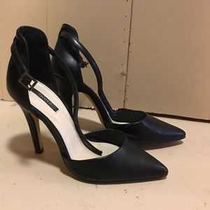 Pointed black heel with ankle strap