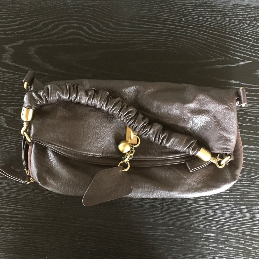 Chocolate brown faux leather purse. Never used.