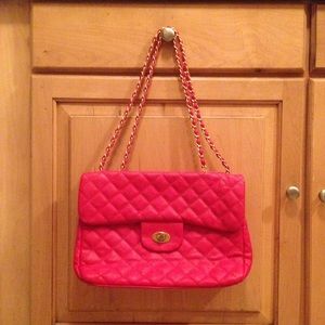 Red quilted convertible handbag