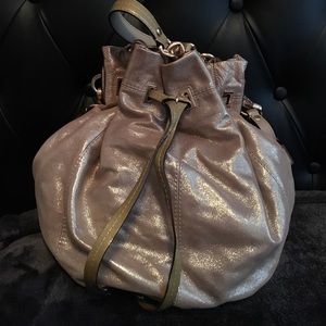 Beautiful shimmery gold bucket coach bag