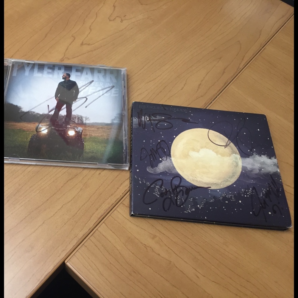 Autographed Tyler Farr and Reckless Kelly's CD's.