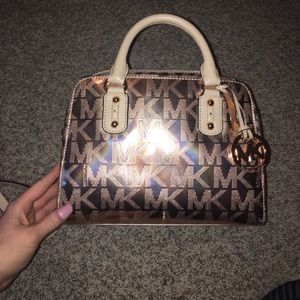 Rose gold, mini, Michael Kors purse.