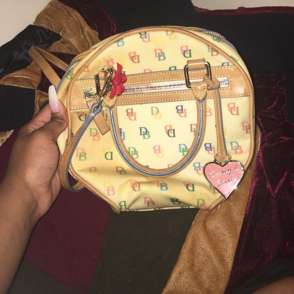 White multicolored dooney & bourke bag
