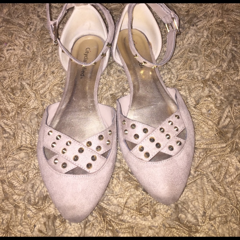 Point toe studded ankle strap flats.