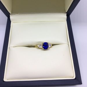 Blue Sapphire, diamond and 18K gold ring.