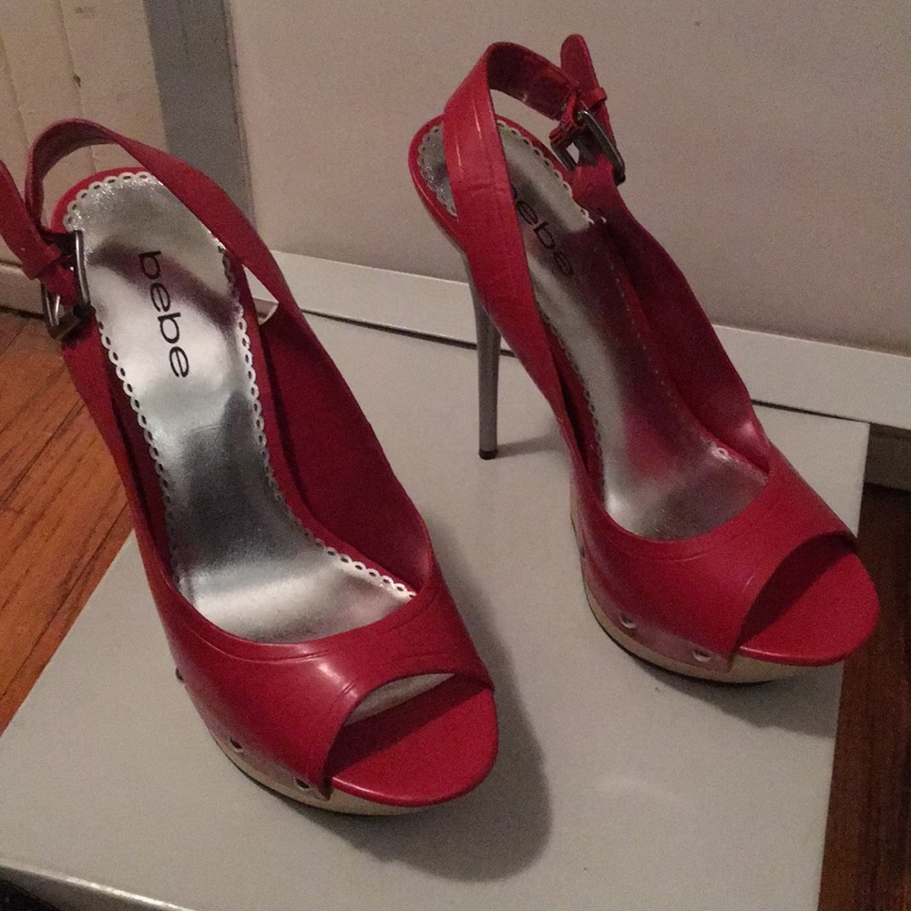 Bebe, open toe , sling back platform heels.