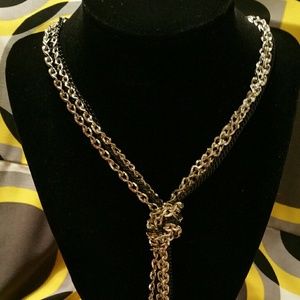 Black and silver long knotted necklace.