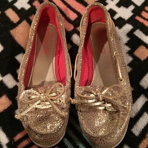 Girls gold slip on Sperry brand shoes. Size 13.5.