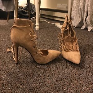Tan suede strappy heels.