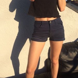 Blue high waisted shorts.