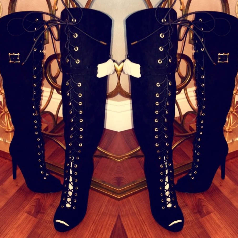 Black lace up boots .