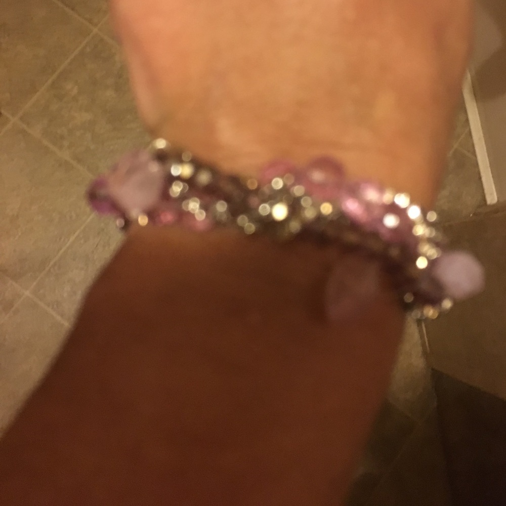 Silver bracelet mixed with pink stones.
