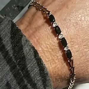 A 10 karat gold blue sapphire and diamond bracelet