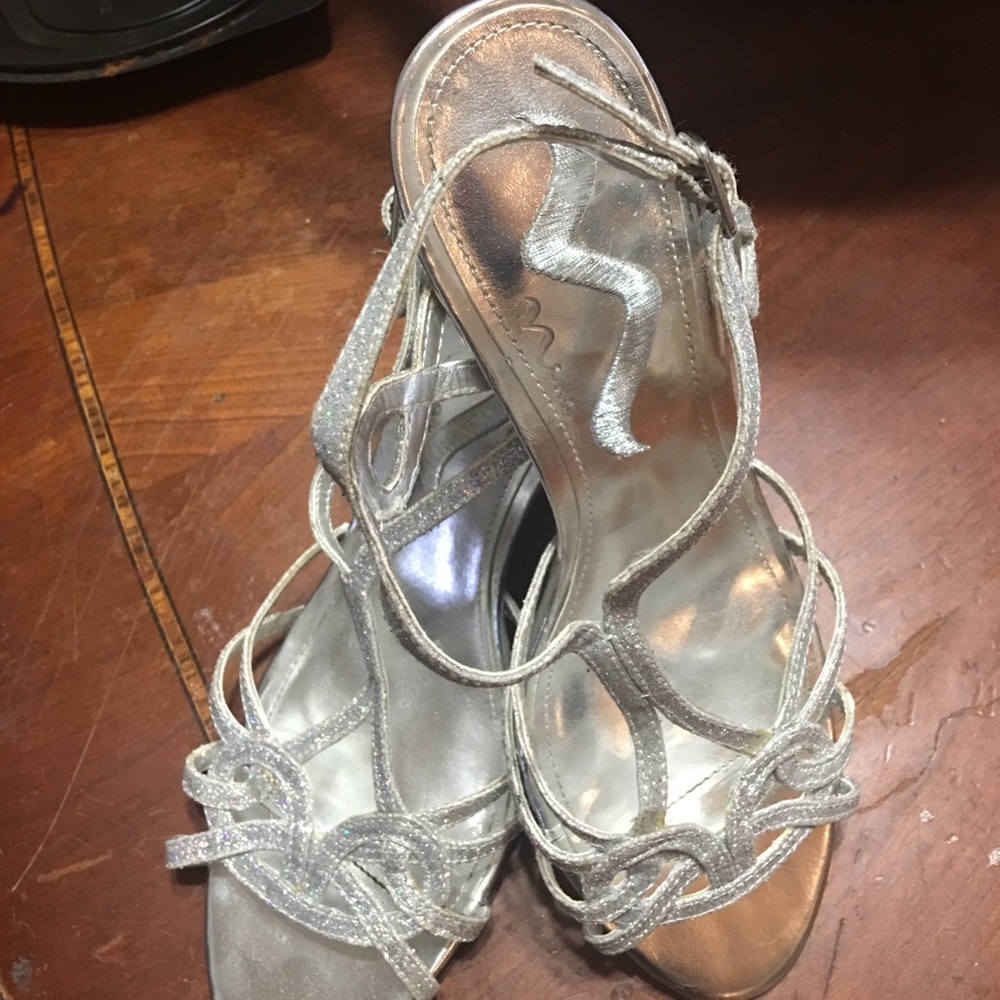Super sexy strappy silver heels.