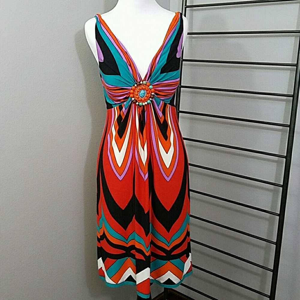 Beautiful vibrant dress. Beaded detail in bodice.
