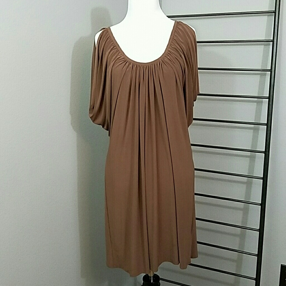 Draped dress with peek a boo sleeves.