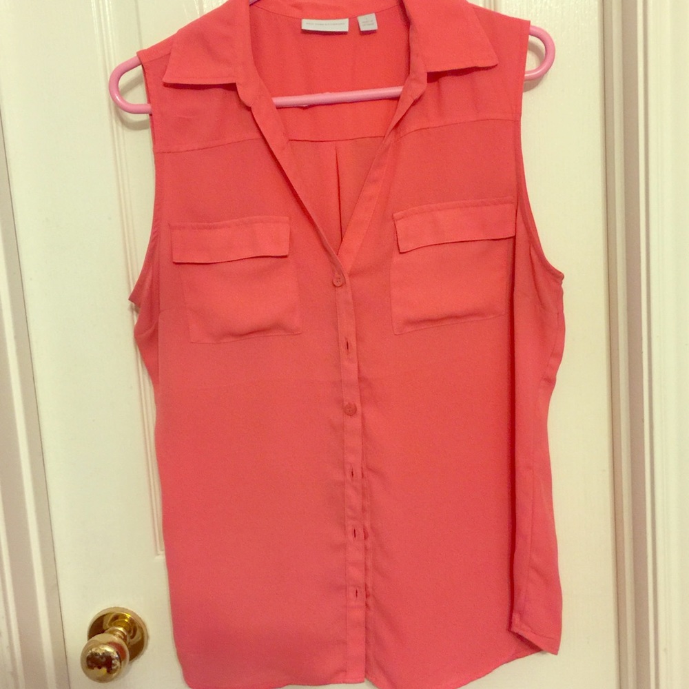 Orange sleeveless button down blouse