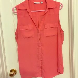 Orange sleeveless button down blouse