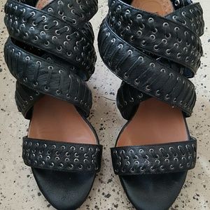 Black leather platform heels with silver detail