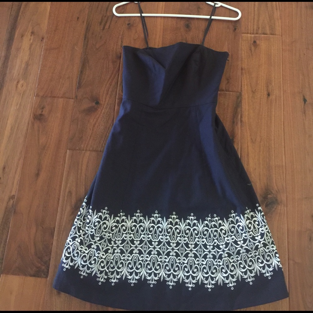Navy dress with White embroidered skirt.