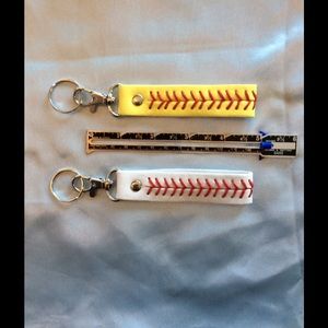 Two Baseball or Softball leather keychain fob.