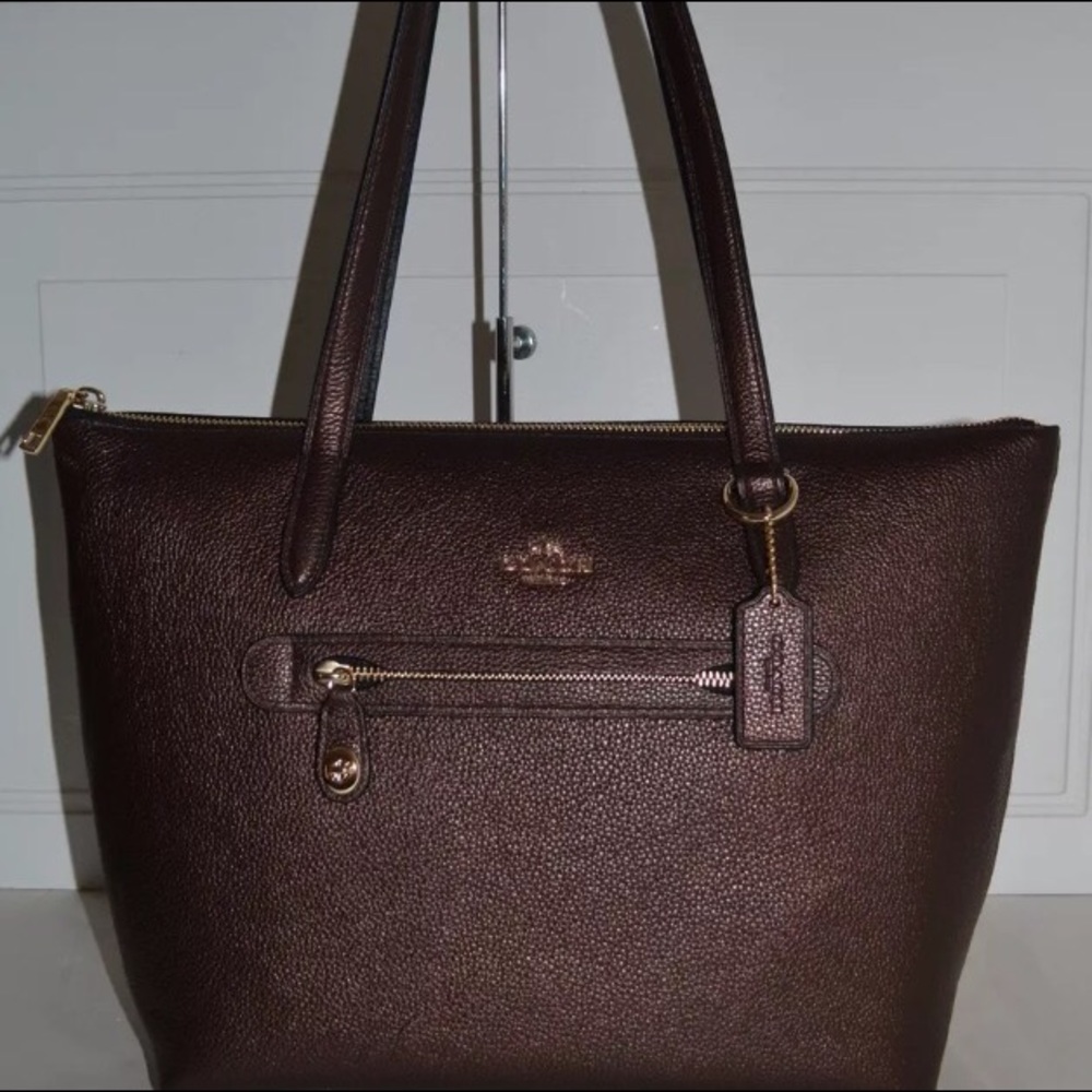 This is a Coach Taylor tote. Bronze and NWOT