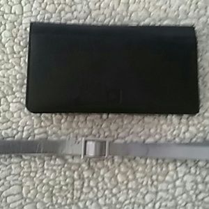 Leather checkbook cover and silver dress belt