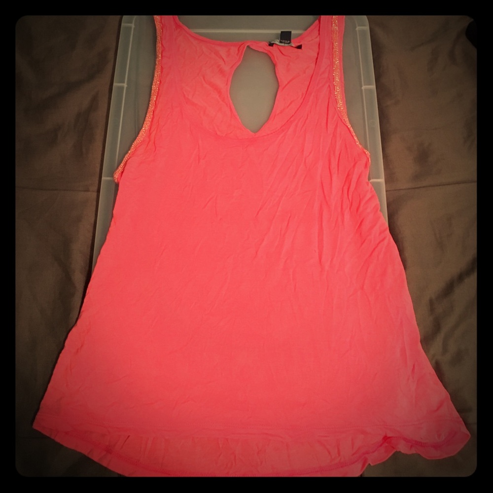 Coral tank top with oval cutout on back