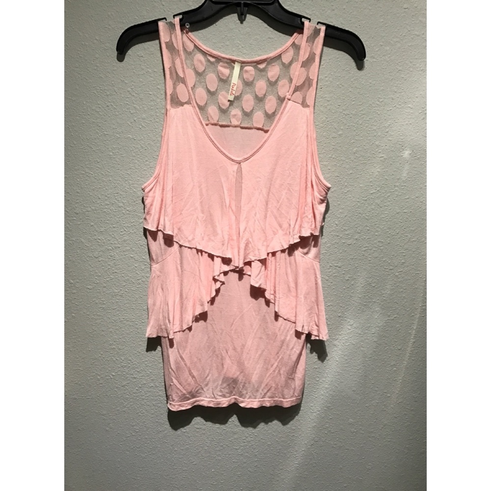 Pink sleeveless top.
