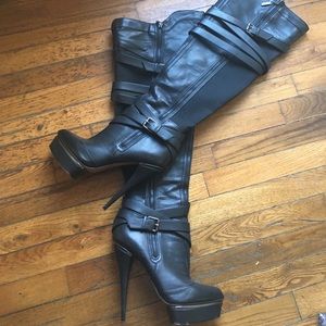 Over the knee strapped boots