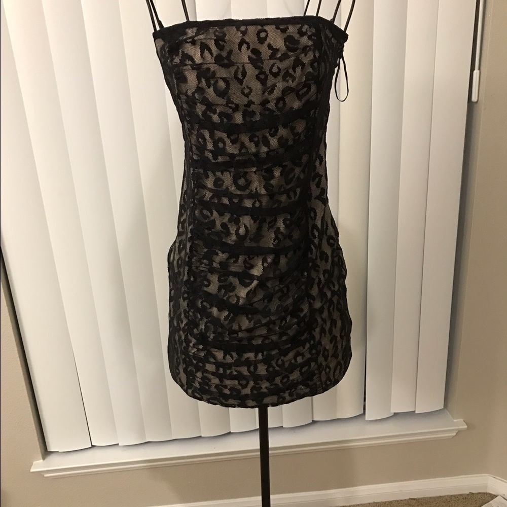 A party leopard skin dress. Never worn!