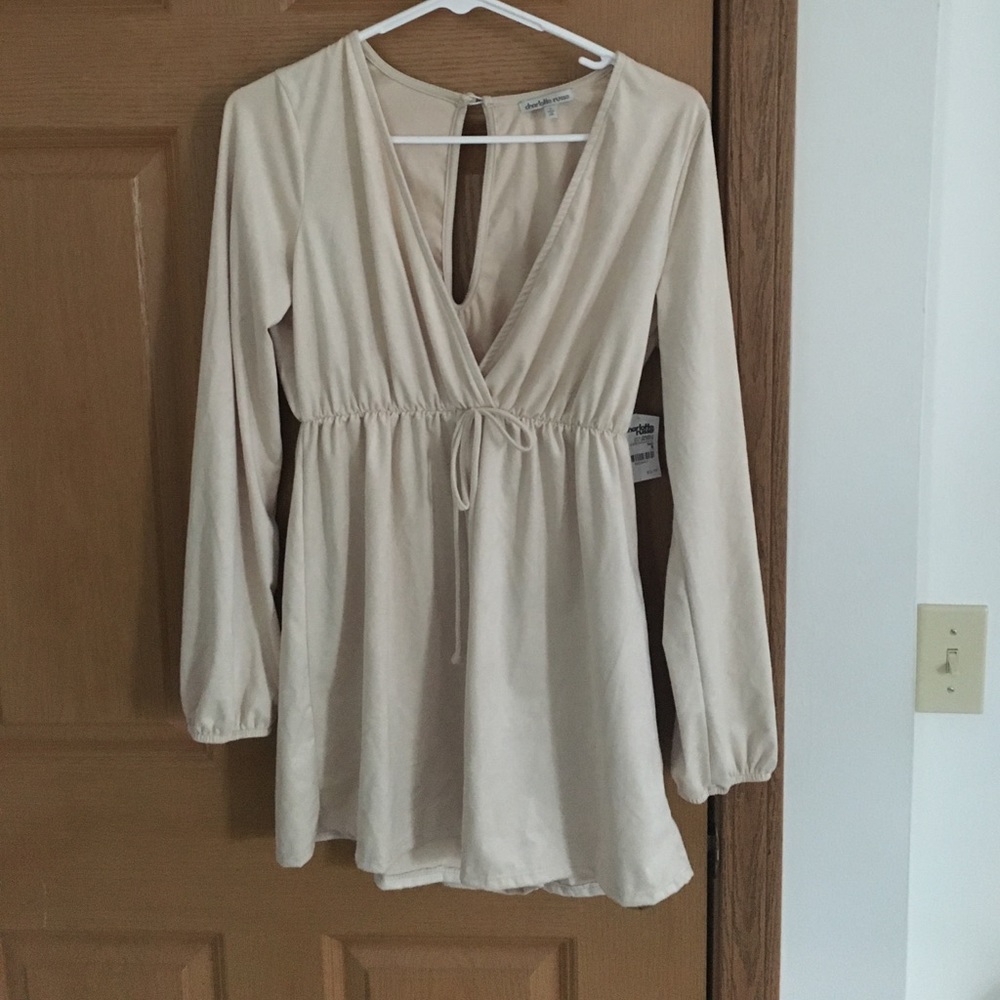 Super cute, cream colored romper
