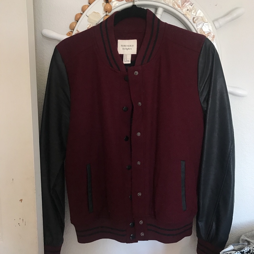Burgundy-letterman jacket w/ faux leather sleeves.