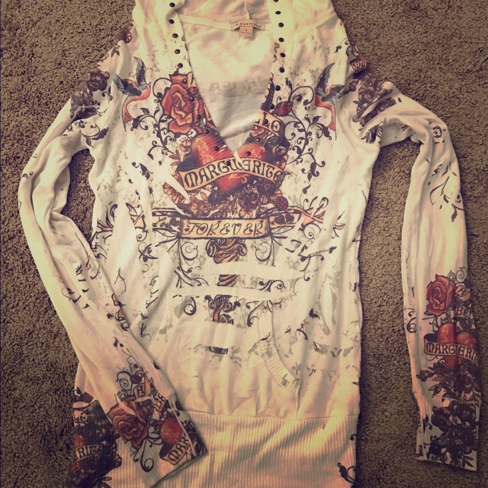 A sweater top with hoody