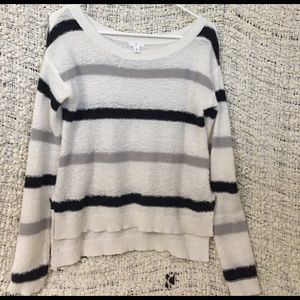 Black, grey, white striped sweater
