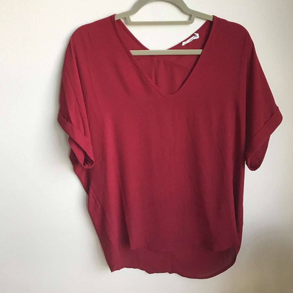 Francesca's red flowy top