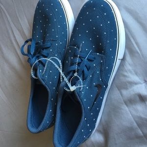 Navy blue and white nike sneakers