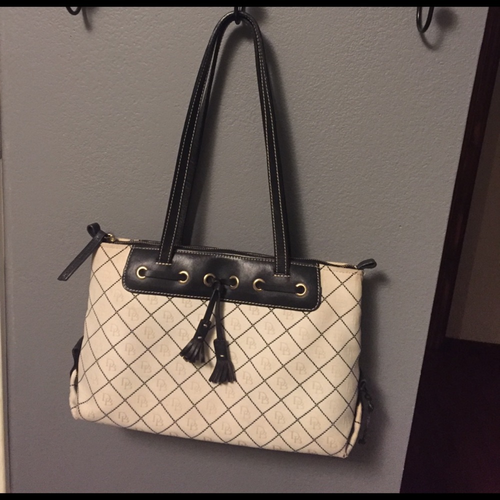 Cream & black Dooney & Bourke tassel bag
