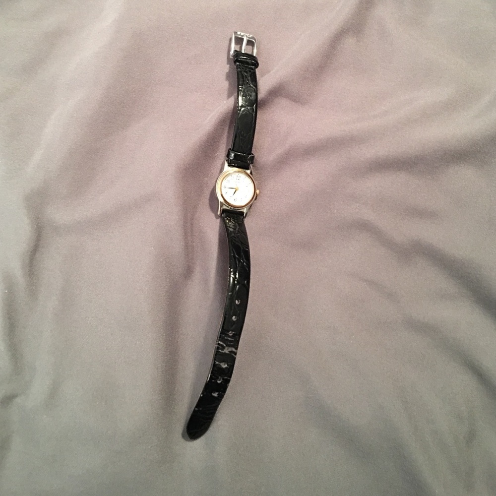 Seiko watch with leather band.