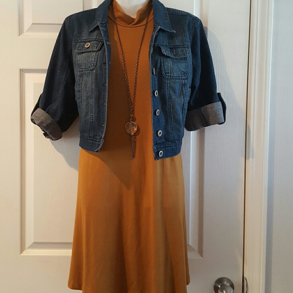 Mustard color dress with tie on the side.