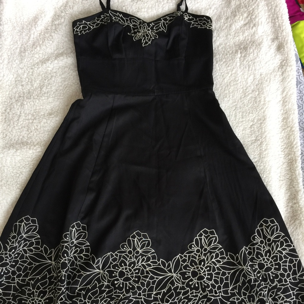 Black dress with white embroidery