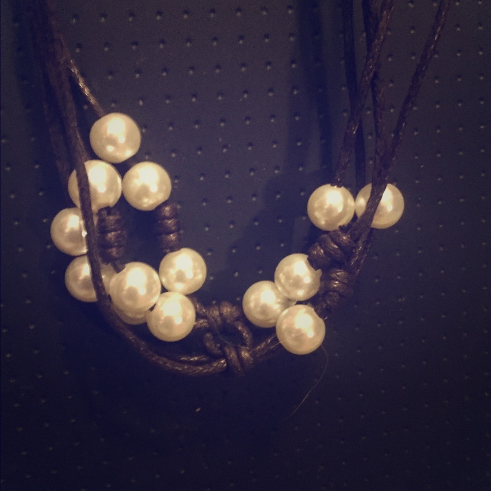 Pearls on layered brown thread