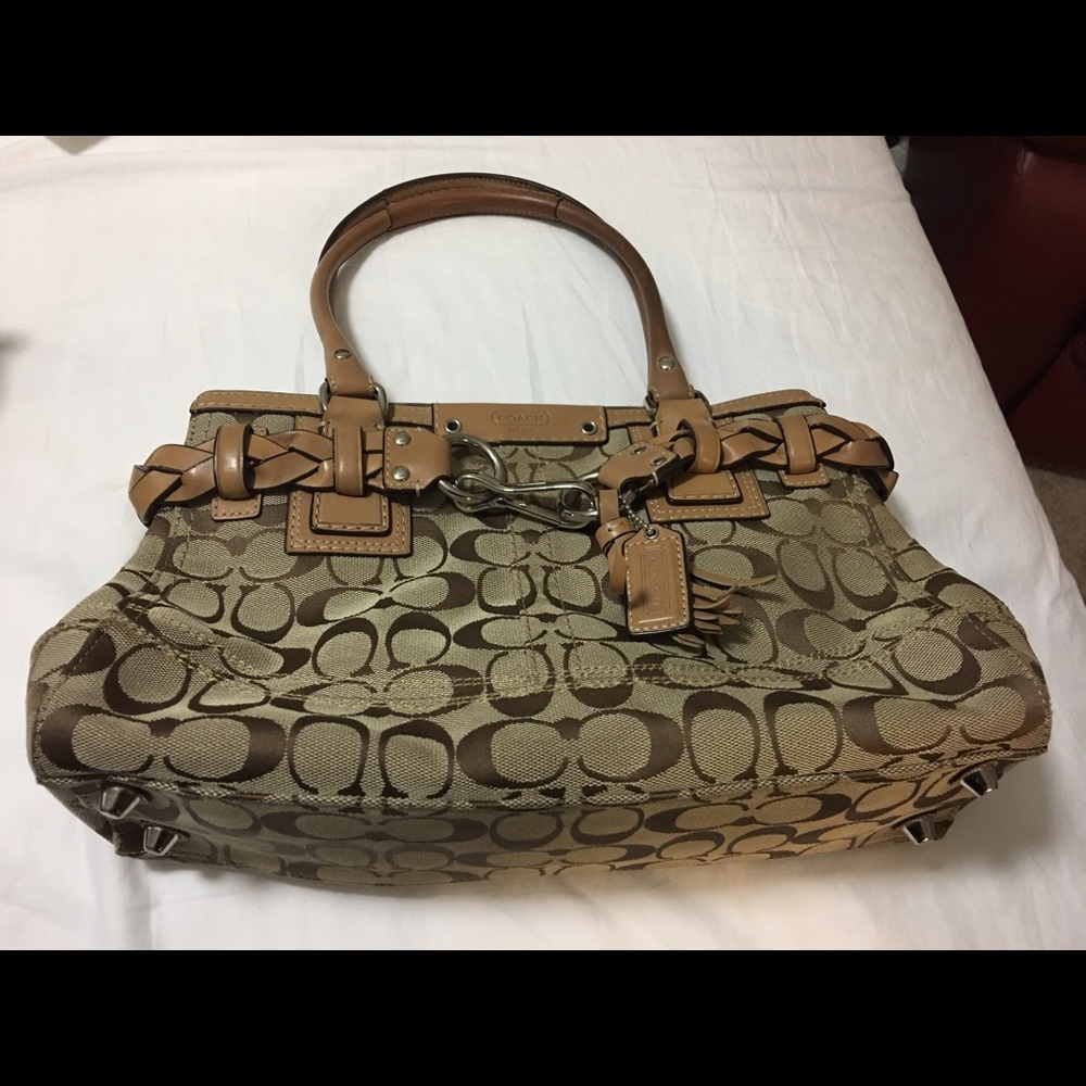 Nice clean Coach purse clean inside and outside .