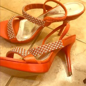 Orange high heeled shoes