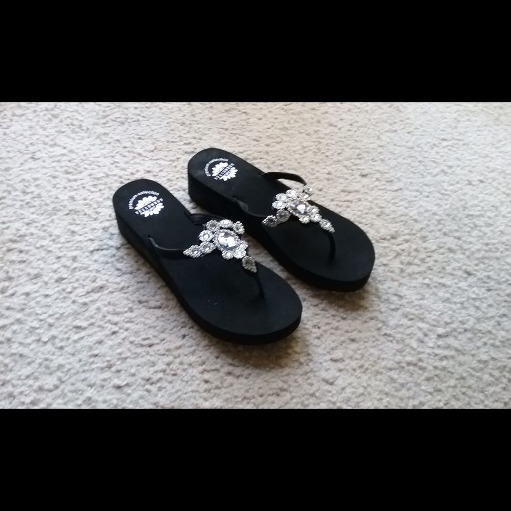 Yellow Box black sandals.